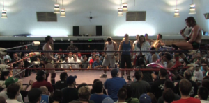 Chris Hero on the mic taking to Bryan Danielson after winning the PWG World Championship in Reseda during his final PWG match before going to WWE.