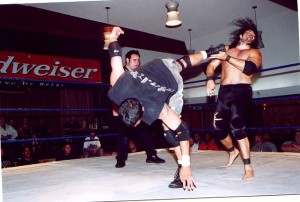 Primetime Peterson kicking Peter Maivia Jr. at an ACW event in Reseda